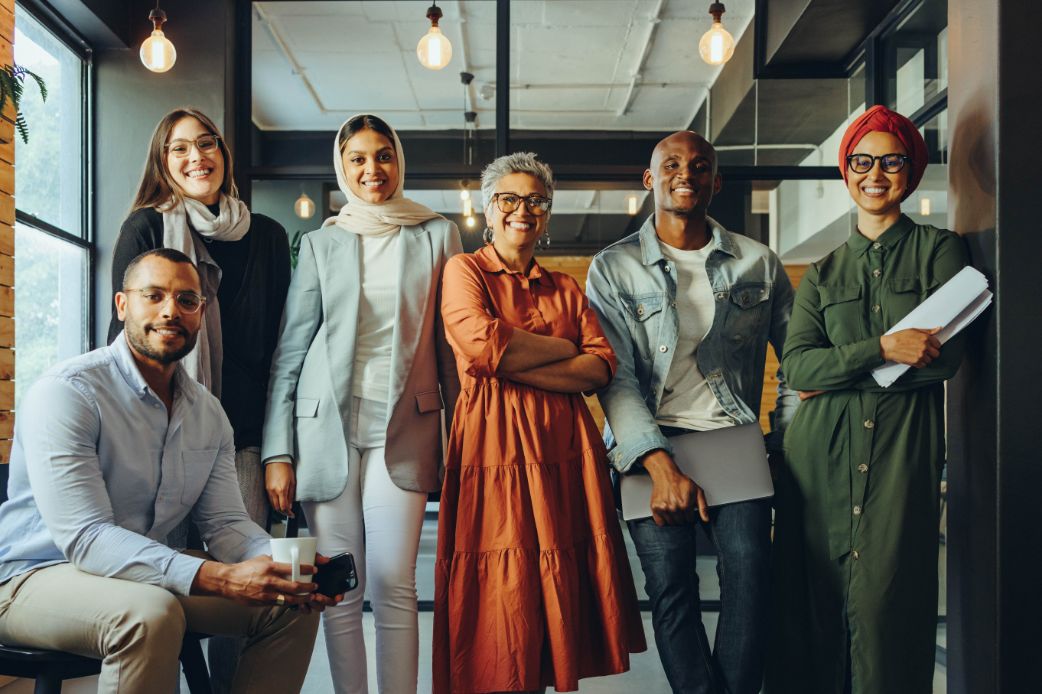 Smiling group of people in an office meeting room